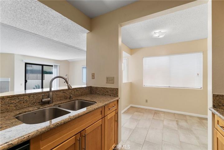 Kitchen opens to living & dining rooms
