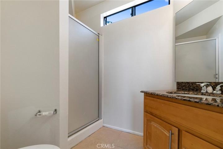 Walk-in Shower in Bath 2, granite counters
