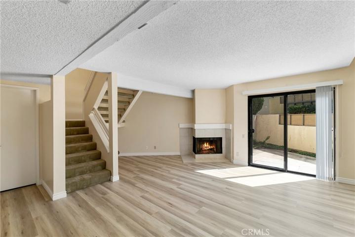 living room with fireplace, slider to patio