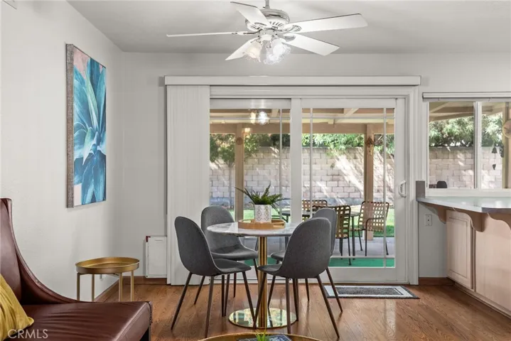 the breakfast nook leads through double paned milgard sliding doors to a full covered patio