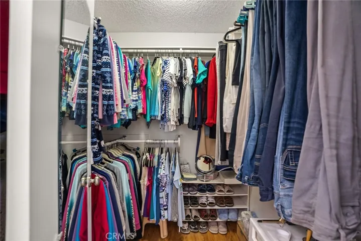 Plenty of space in master walk in closet