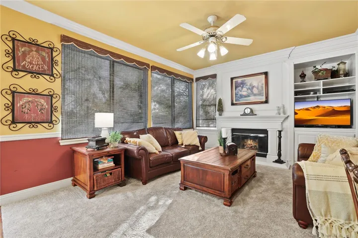 Family Room.
FYI, That is not a stain on the carpet, it is light, it is newer carpet