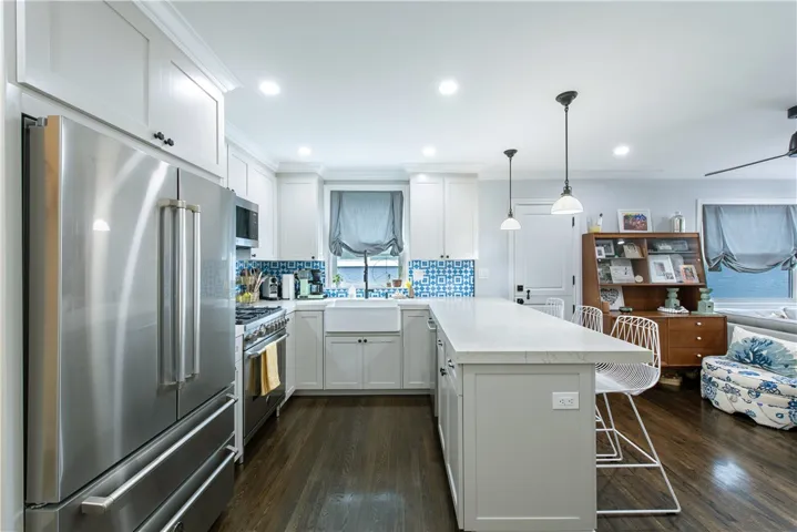 Kitchen wall was removed in 2021 to create a wondeful open gathering spot for the home