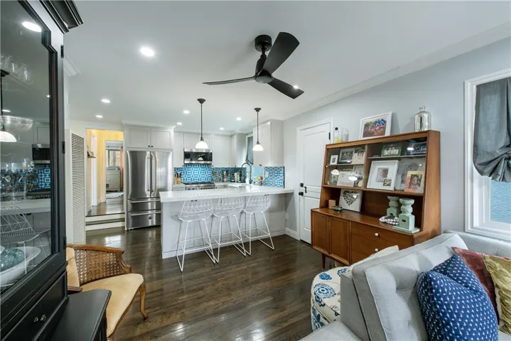 Highlights include the remodeled and opened kitchen, hardwood floors, recessed lights, crown molding, custom window treatments and more