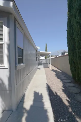 side yard leading to deck ramp