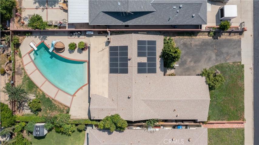 Areal photo of home, shows 21 solar panels.