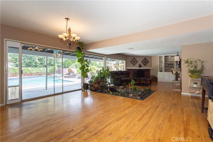 Dining area, living room, double sliding glass doors, with window wall to wall.