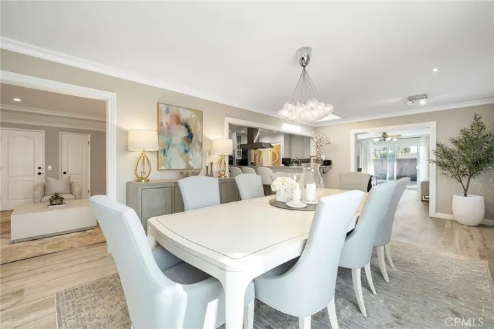 Dining room is decked with large picture windows bringing in lots of natural light.