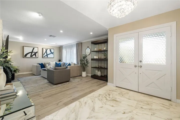 Marble tile floors on foyer entrance.