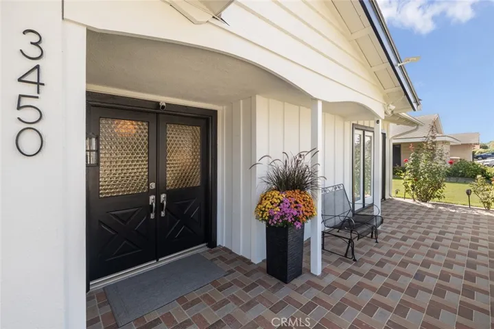 Gorgeous brick-paved front porch.