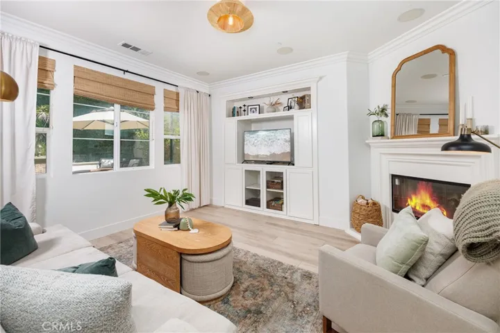 Adorable family room with fireplace.