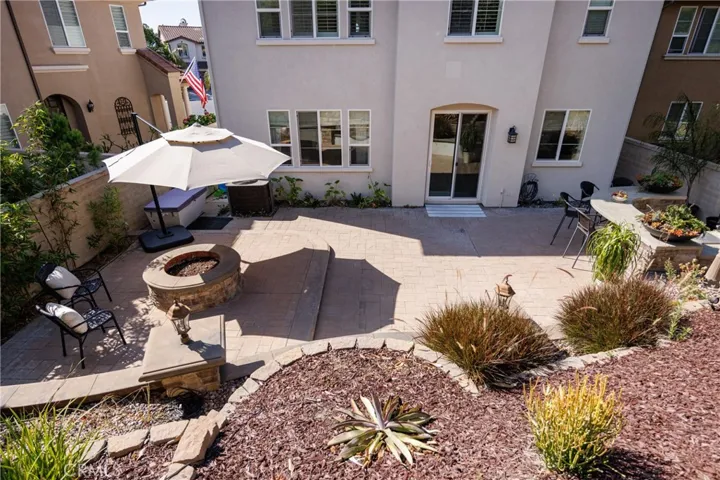 Wonderful hardscape and trellised backyard