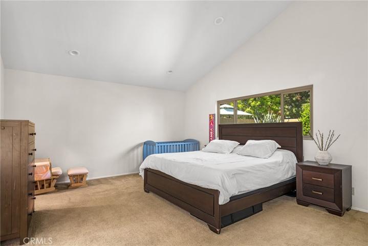 Master bedroom with vaulted ceilings