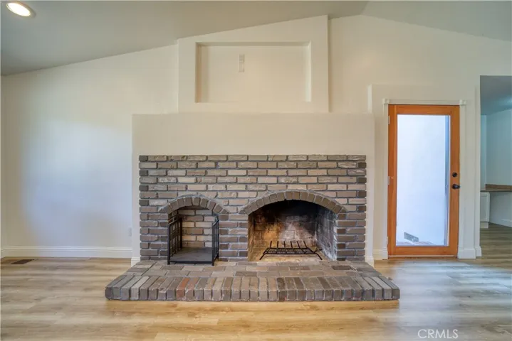 Door to patio next to fireplace