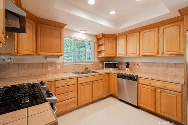 Lovely updated kitchen, newer tile floors and all appliances will stay with the residence.