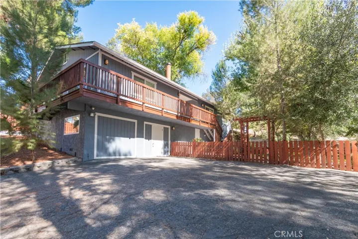 Down a private road and nestled in the trees is this well maintained home.