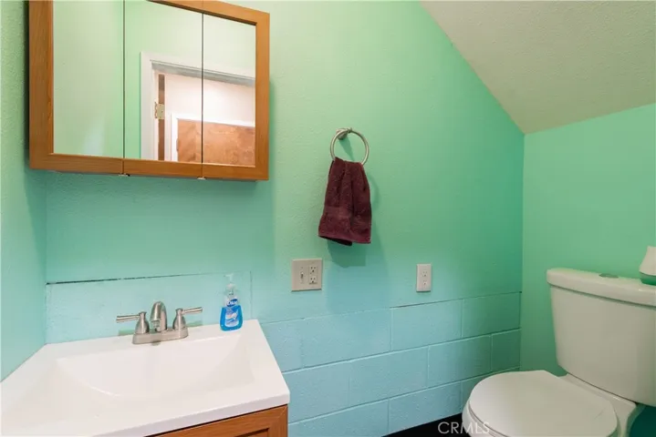 1/2 bath under the stairway.