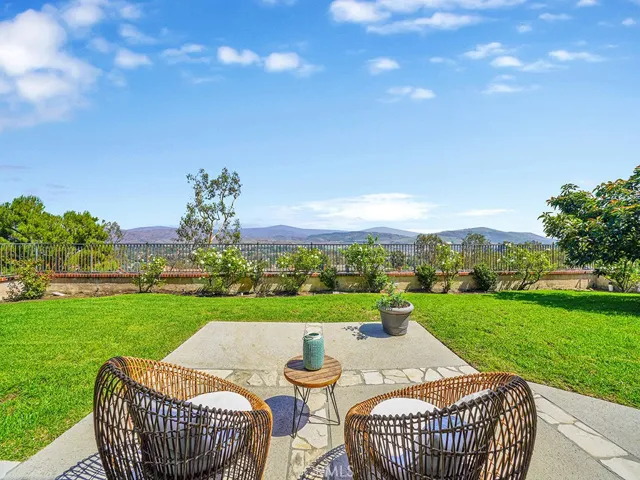 9742 Willow Glenn Circle offers an expanded flat and usable yard with stunning views of the Santiago Hills!