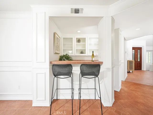 Famiy room offers this wet bar with builtins.