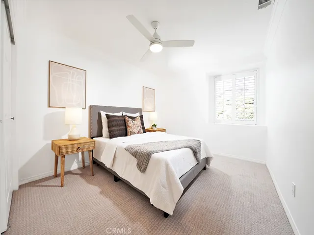 Fourth bedroom adjacent to bonus room is like a retreat in its own right.
