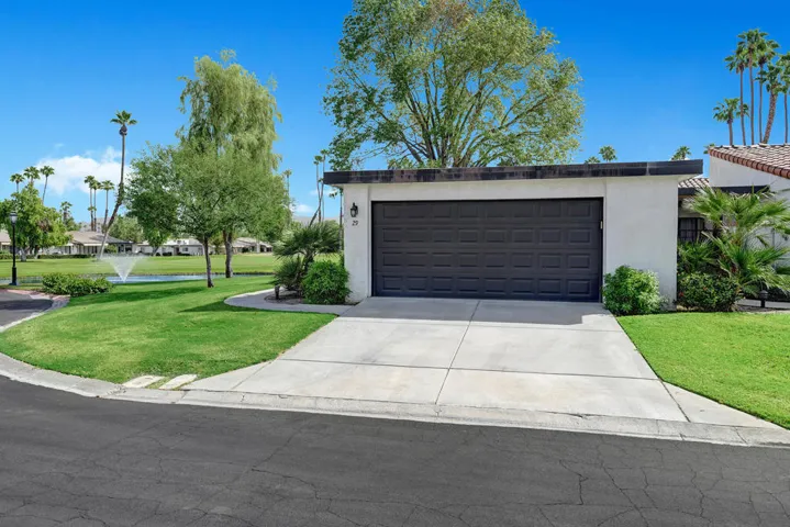 FRONT OF HOME TOWARDS LAKE.jpg mls