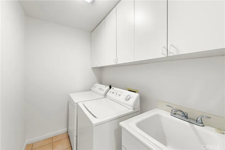 inside laundry room with utility sink