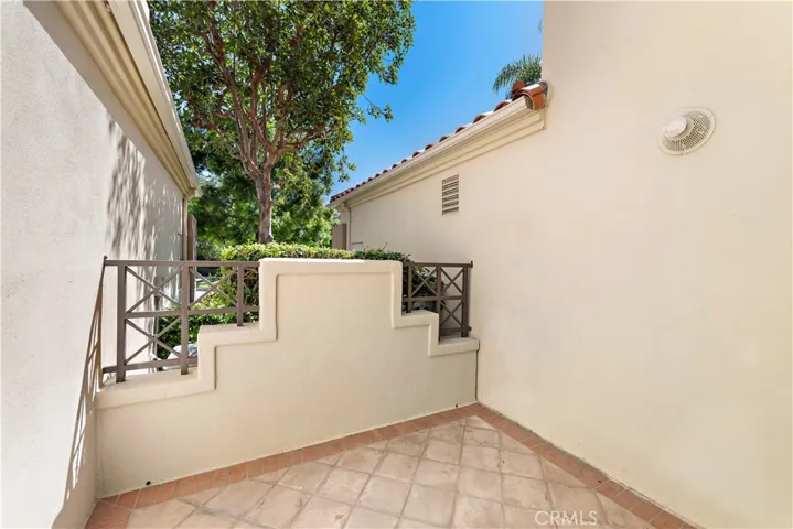 outside private patio with room for a bistro table and chairs