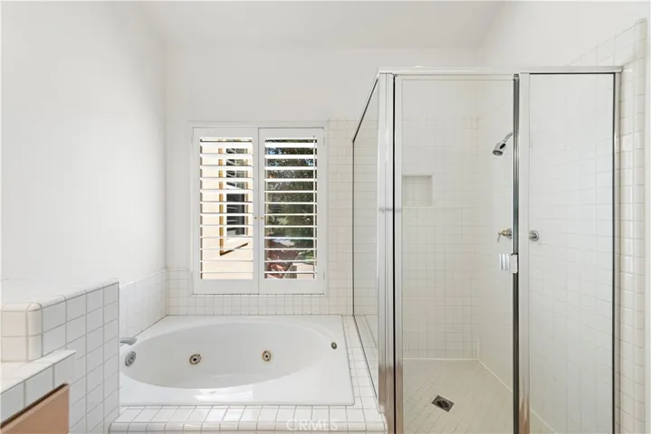 Primary suite bathroom with spa-tub