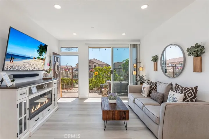 Living room with an abundance of natural light and easy access to patio.