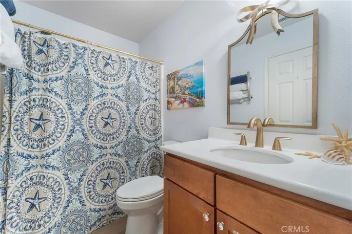 Primary bathroom ...access to walk in closet with organizers