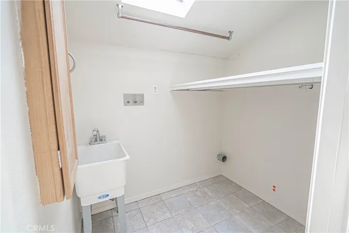 Separate Laundry Room w/sink and skylight