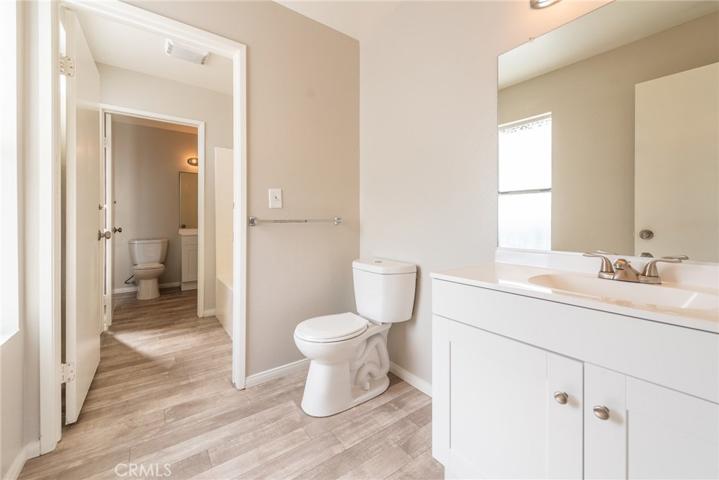 View of both bathrooms. This bathroom leads into front bedroom and middle room is bath/shower area.