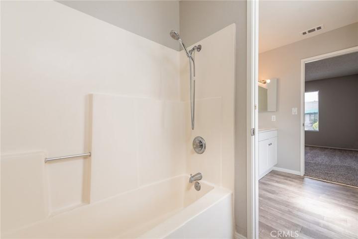 Tub/shower area is in between both bathrooms.