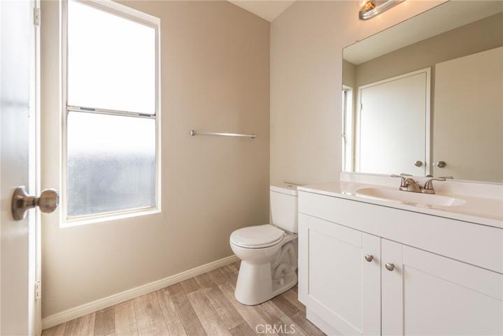 This bathroom leads into hallway and opens into tub/shower area