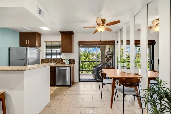 Dining Room with Sliding Glass Door Leading Out to the Private Balcony Area