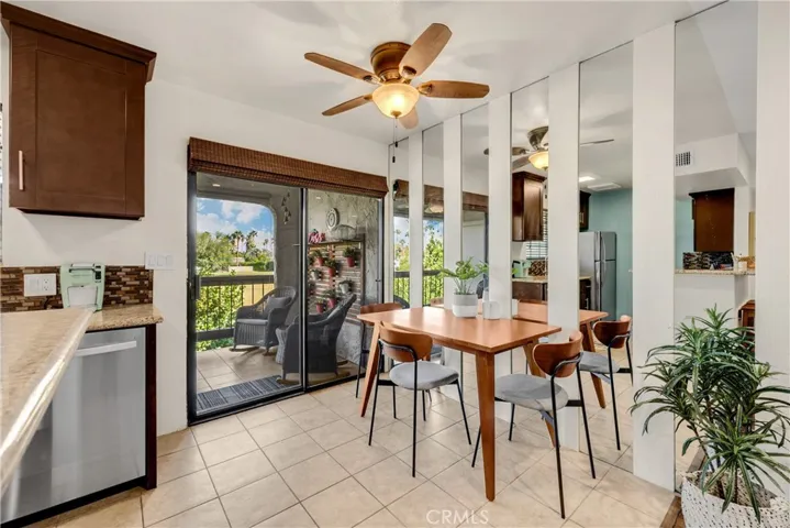 Dining Room with Sliding Glass Door Leading Out to the Private Balcony Area