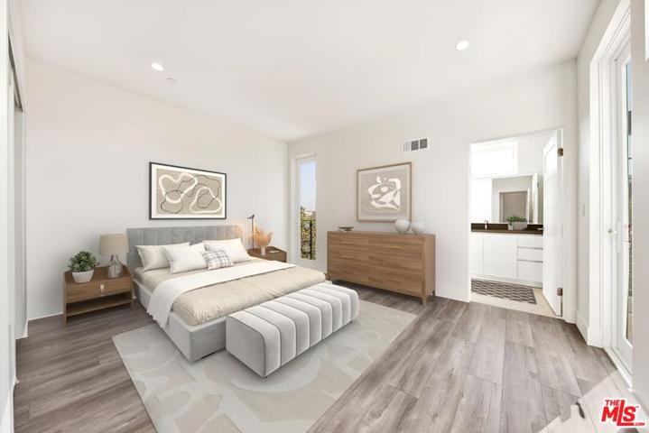 2nd bedroom with its bathroom and walk-out patio