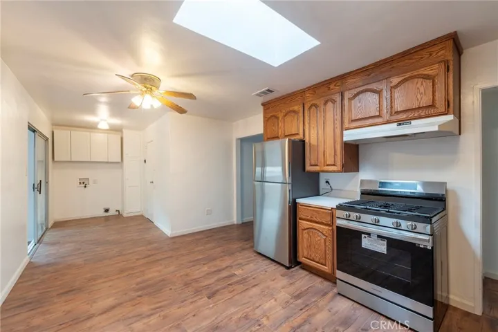 Kitchen looking toward where laundry hookups are