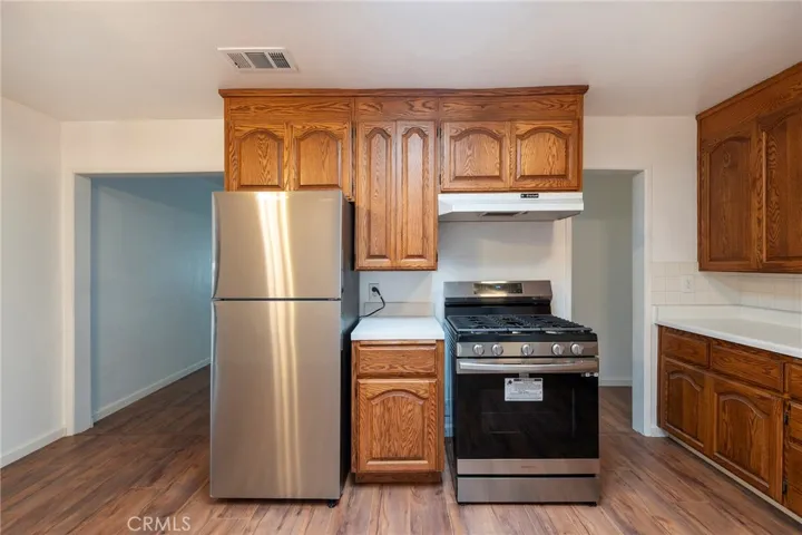 Kitchen with new refrigerator and stove