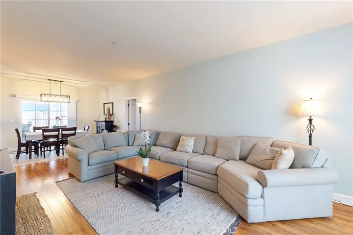 Living room opening into dining area.