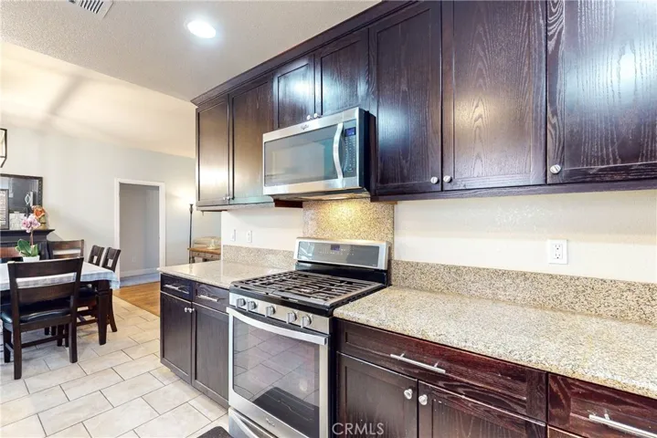 Stainless steel stove and built-in microwave.