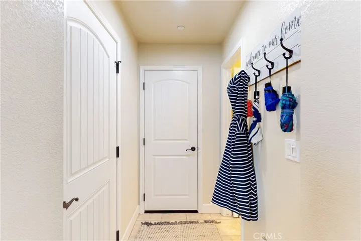 Front door on the left, and the garage door straight ahead.