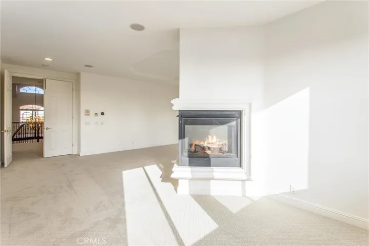 Master suite dual sided fireplace and sitting area