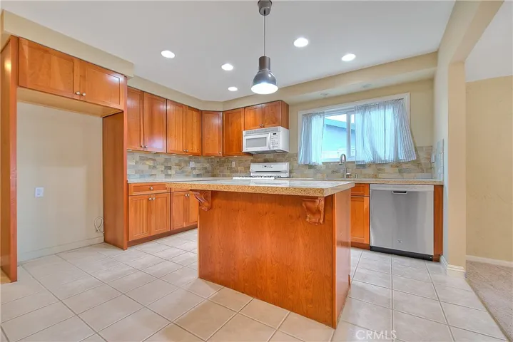 Preview 3 of 10 – Updated Kitchen with Granite Countertops, Center Island, Pantry