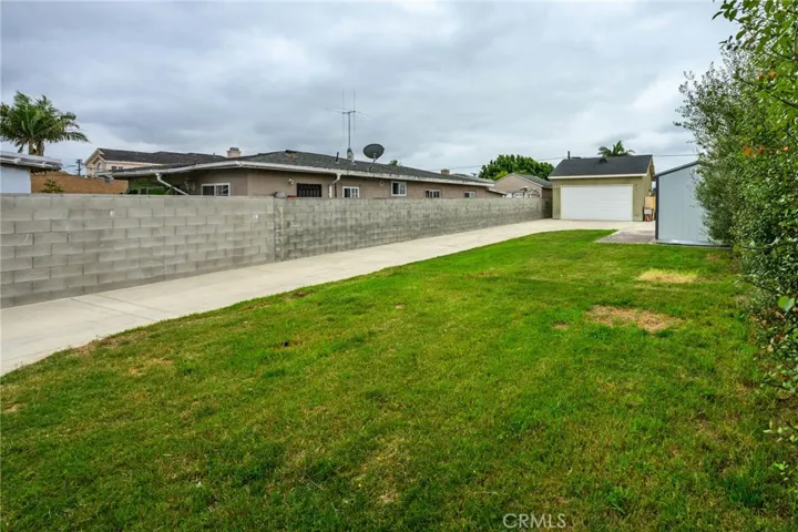 Side view from back yard to garage