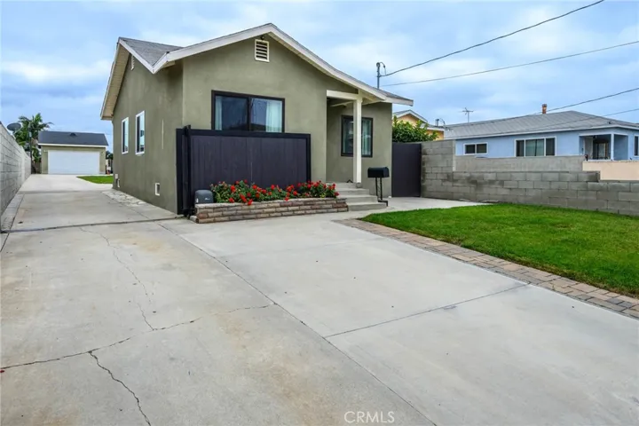 Front of House with the drive way gate open