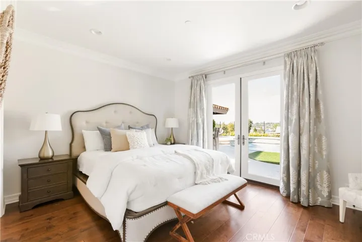 Mainfloor Ensuite Bedroom with French Door Entry to Backyard