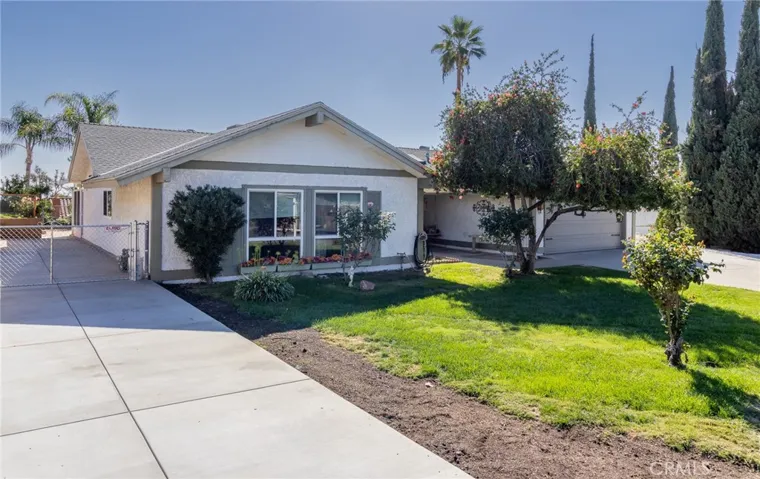 Front of home with RV parking.