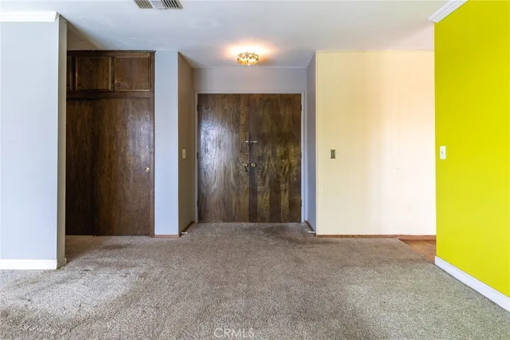 Living room area toward front door.
