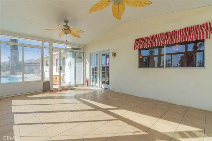 Indoor patio area leading to pool area.